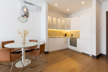 Interior of a modern kitchen with dining area