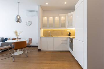 Interior of a modern kitchen with dining area