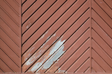 Red metal garage door, paint is beginning to peel. Perfect texture image, ideal for graphic...