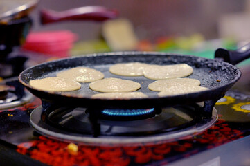 preparing meal on stove