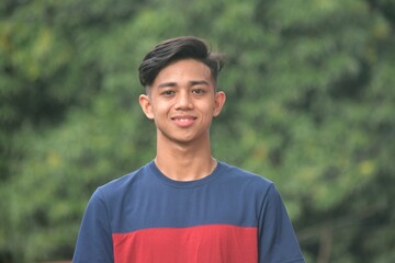 A Happy  Filipino Teen Boy Outside