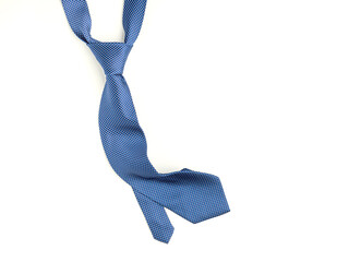 Father's day composition of blue tie laid isolated on a white background. Top view. Flat lay with space for text