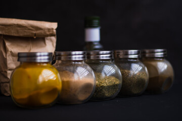 easonings for cooking, spoons with seasonings, jars with seasonings