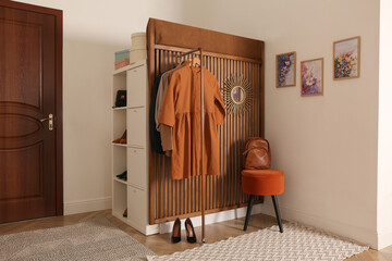 Modern hallway interior with stylish furniture and clothes rack - obrazy, fototapety, plakaty