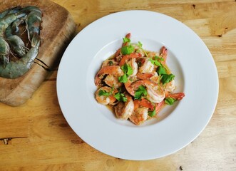 Garlic fried prawns in a white plate