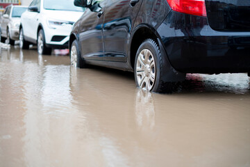 cars move in water road, flood disaster outside