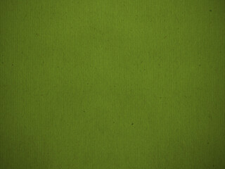 Olive green paper texture with subtle vignette.  Colored cellulose paper with visible fibers. 