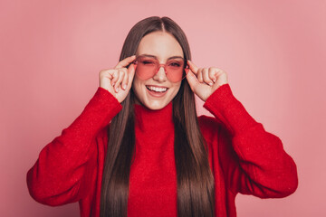 Photo of youngster girl good mood winking eye flirt isolated over pink background