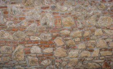 Restored old brick and limestone wall