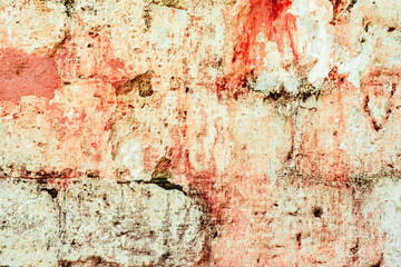 Texture of a brick wall with cracks and scratches which can be used as a background