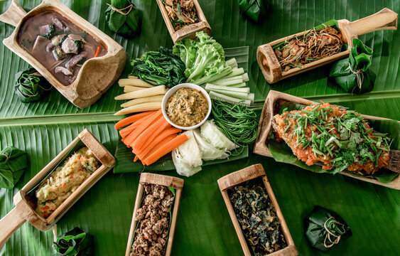 Local Akha food served in bamboo containers served to tourists at Ban Doi Pha Mee, an Akha village in Chiang Rai Province, Thailand.