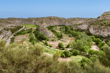 Fototapeta na wymiar Green meander with cultivated fields landscape in Jorquera, La Manchuela region, Spain 