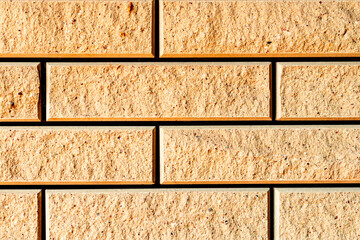 Texture of a brick wall with cracks and scratches which can be used as a background
