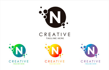 N Dots Letter Logo set in Beautiful Gradient Color. N bubble letter in black, purple, yellow and green gradient vector illustration. 