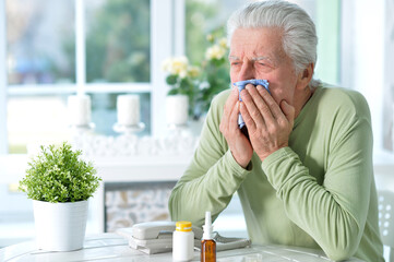 Portrait of sad sick senior man