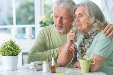 Close-up portrait of an elder couple  making inhalation