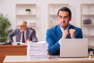 Two employees working in the office