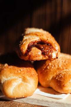 Close-up of buns with condensed milk. Closeup of confectionery. Appetizing view. French pastries and cooking