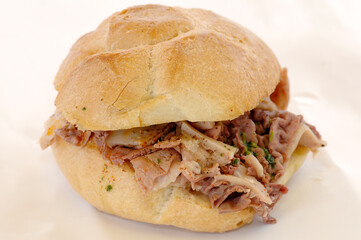 Lampredotto is the typical street food of the city of Florence in Tuscany and is a sandwich with a cow's stomach in a tomato sauce and put to stew