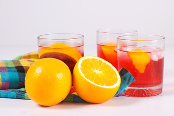 Cocktail drink-orange juice fresh juice with strawberry with lemon orange, mango, pineapple, apple, grapes isolated on white background. High-resolution image