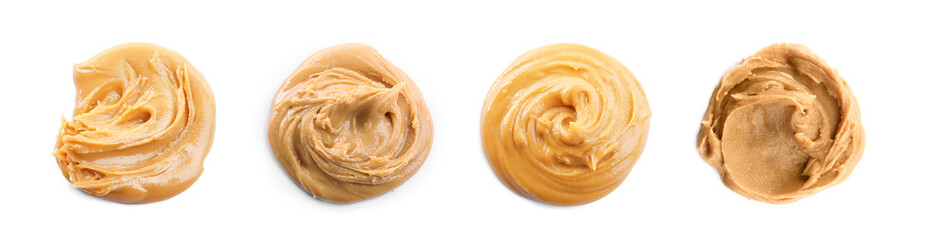 Fototapeta premium Set with delicious peanut butter on white background, top view. Banner design