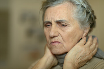 Close up portrait of sad ill senior woman