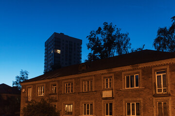 the light burns in one window of the multitude in a multi-storey residential building
