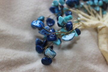 close up of a blue necklace