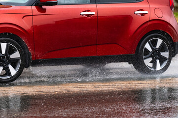 car rain puddle splashing water