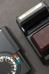 vintage electronic flash units, photographed from above with a macro lens, on grey background