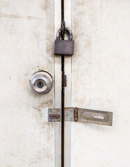 The old metal knob door and brass master key on the PVC door.