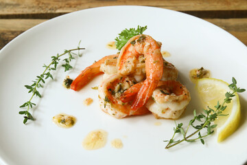 Lemon butter herb shrimps on plate