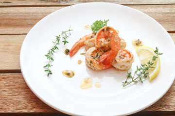 Lemon butter herb shrimps on plate