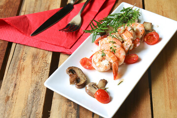 Rosemary thyme shrimps on plate
