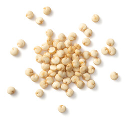 A small pile of raw white quinoa isolated on white background, top view