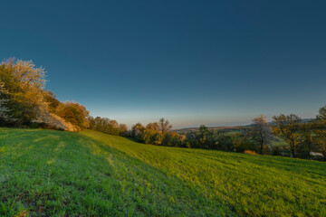 Meadows over Vizovice town with sunrise and fresh color air in east Moravia
