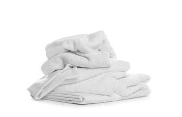 Pile of towels and bedding on white background