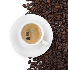 Cup with aromatic coffee and pile of beans on white background, top view