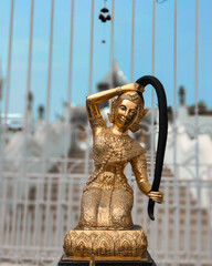 A statue in front of Temple