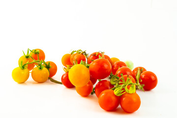 Cherry tomatoes. Fresh ripe cherry tomatoes closeup isolated on white background