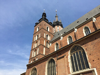 View of the St. Mary's Basilica, a Brick Gothic church adjacent to the Main Market Square in Kraków, Poland. It serves as one of the best examples of Polish Gothic architecture.