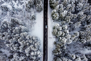 Aerial view of a snowy road in winter