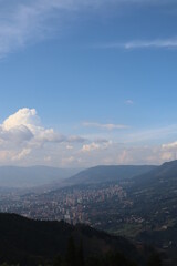 Panorama view to Medellin in Colombia South America, view from the Pablo Escobar prison in the hills around Medellin, observe in the valley the huge skyscrapers and houses from the amazing metropole 