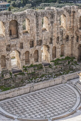 Top view of Greek ruins of Odeon of Herodes Atticus (161AD) - stone Roman theater at the Acropolis hill. Athens, Greece.