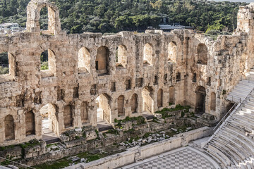 Top view of Greek ruins of Odeon of Herodes Atticus (161AD) - stone Roman theater at the Acropolis hill. Athens, Greece.