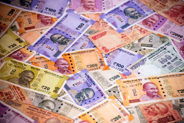 Cash in various Indian Paper Currency (rupees) as a background. Indian banknotes.