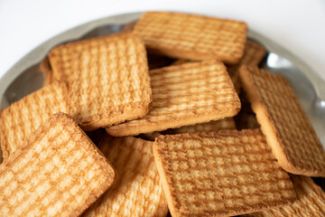 cashew cookies on white indian biscuits wheat biscuits in the steel plate white background
