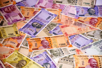 Cash in various Indian Paper Currency (rupees) as a background. Indian banknotes.