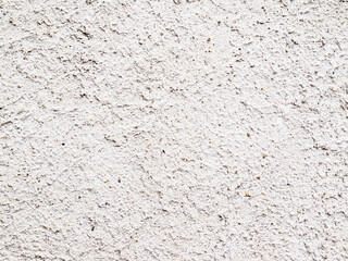 Grainy surface with small stones roughly profiled.