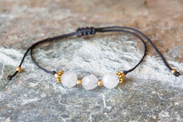 Rose quartz cubic cut mineral stone bead bracelet on natural background